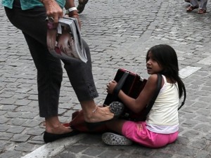 Athens-woman-kicks-roma-child-accordeon-player1-300x225
