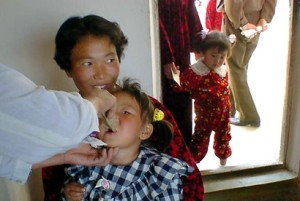 A North Korean girl takes a dose of vaccine at a clinic on National Health Day in North Hwanghae in this picture taken May 2002. Malnutrition rates among children in North Korea have improved considerably over the past four years, according to a new survey, but the UNICEF and the World Food Programme, that announced the findings, said recently the gains could be lost if international support for humanitarian assistance to the country continues to slacken. Picture taken in May 2002. FOR EDITORIAL USE ONLY REUTERS/UNICEF/Handout GN/CP - RTRJREM