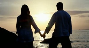 stock-footage-couple-silhouette-at-the-beach-sunset-light